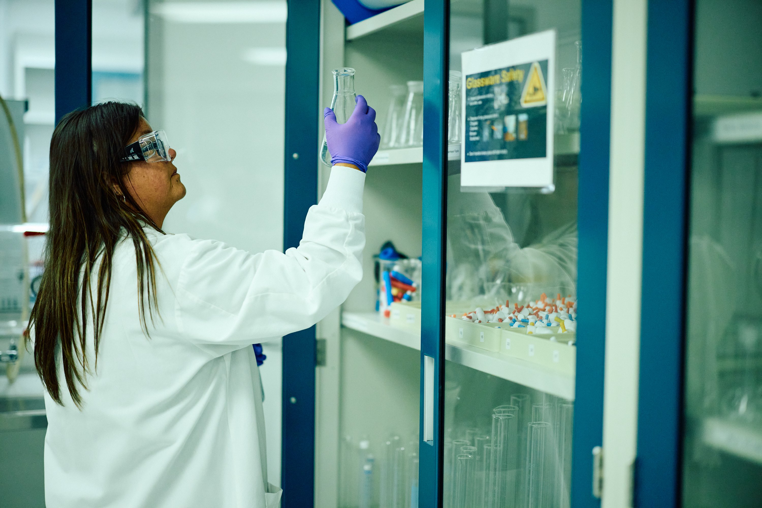 Scientist holding beaker